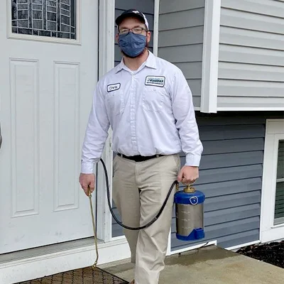 technician standing outside home
